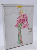 Front of the box showing the Classique Collection Barbie titled Evening Sophisticate with fashion illustration of doll.