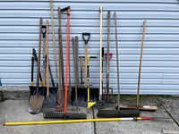 Full lineup of all 12 tools leaning against siding