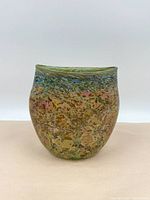 Front view of the vase showing overall shape and multicolored fleck pattern