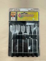 Photo of the 6 piece wood spade drill bit set in original packaging showing layout and sizes
