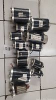 Overview of assorted electric motors for e-bikes and e-scooters, varying sizes and labels visible