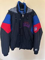 Front view of jacket hanging on hanger