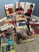 Photo showing a selection of knitting books with colorful covers illustrating knitwear projects and techniques.