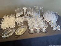 Full layout of the 62-piece glassware and serveware set showing all items included