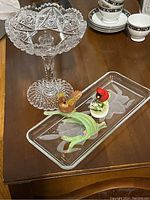Cut glass pedestal bowl showing scalloped edges and starburst patterned base