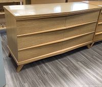 Full front and side view of dresser showing overall design and tapered legs