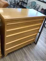 Front view of five-drawer oak dresser