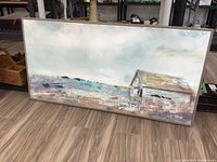 Full image of framed textured canvas print showing barn in rural field with overcast sky in soft muted colors.