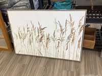 Full frontal photo of framed canvas print showing the tall grass image and the full frame.