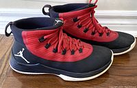 Right side profile view of the red and black Nike Air Jordan Ultra Fly 2 shoes showing design and Jumpman logo.