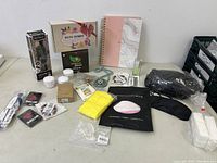 Wide view of all items on a table showing assortment of beauty and personal care products.