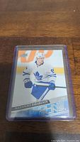 Close-up of Alexander Barabanov YoungGuns Rookie hockey card in protective case showing player in Toronto Maple Leafs uniform.
