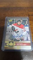 Front view of Griffin Reinhart hockey card in Team Canada uniform with autograph in blue ink.