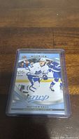 Front image of Matthew Knies rookie hockey card in protective sleeve.