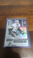 Full view of Sidney Crosby collectible hockey card featuring shiny, holographic finish and player image.