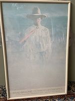 Full view of framed cowboy poster showing the entire artwork and frame.