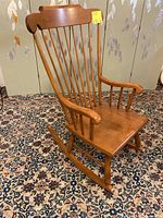 Full view of Vilas maple rocking chair showing front and side profile on patterned carpet.