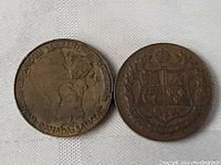 Front and back of 1939 Canadian Royal Visit coin or medallion showing map of Canada and coat of arms.