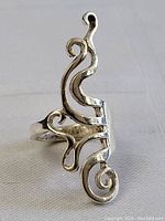 Front view of the sterling silver twisted fork design ring showing an ornate and flowing pattern