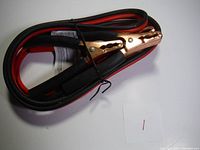 One image showing black and red booster cables coiled, held together with twist tie, showing copper clamps and insulation grips.