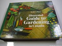 Front cover of the gardening book showing title, author, and colorful gardening tools and vegetables images.