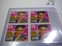 Block of four Elvis Presley 29 cent USA postage stamps in protective holder.