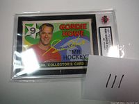 Front view of the graded Gordie Howe hockey card showing the player's photo, name, and 'Mr. Hockey' text inside a protective slab with a grade 9 shown.