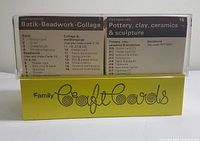 Shows batch of craft cards in yellow holder, front view showing Batik, Beadwork, Collage and Pottery sections.