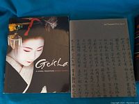 Front cover of 'Geisha: A Living Tradition' showing a photograph of a Geisha.