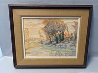 Full view of framed landscape print showing river, trees and house with autumn tones.