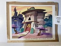 Photo of original animation background painting showing a stylized tropical house with rounded shapes and colorful trees, taped to a board.