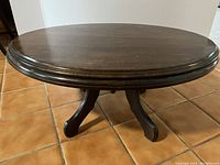 Top view of the oval solid wood coffee table showing surface and shape