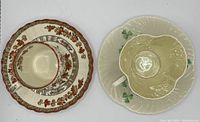 Photo showing both teacup and saucer sets side by side, India Tree on left and Irish Clover on right.