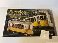 Woodcraft Model Kit box showing front with image of completed Lisbon #28 Streetcar model in yellow and cream colors, and text in Portuguese and English
