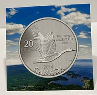 Front of packaging showing the coin design with flying goose, denomination, year and silver purity details.