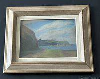 Overall view of framed pastel landscape painting showing the image and frame.