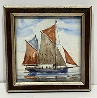 Framed watercolour painting of sailboat with multiple sails on a calm sea, 4 x 4 inches.