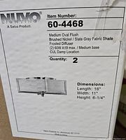 Box with product label showing Nuvo Lighting 60-4468 medium oval flush mount fixtures with measurements and specifications.