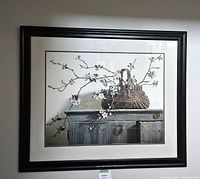 Front view of the wood framed print showing the country decor scene with basket and blooming branches, including matting inside the frame.