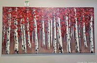 Frontal view of large rectangular canvas print showing an autumn scene with birch trees and vibrant red leaves.
