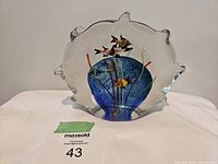 Front view of the Murano glass aquarium sculpture showing colorful fish and aquatic plants inside blue water glass.