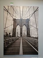 Front view of large sepia tone Brooklyn Bridge canvas print showing the detailed bridge structure and walkway beneath sepia sky.