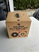 Closed original Elmo 8mm SE Dual film editor box showing branding and model.