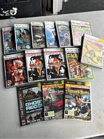 Photo of Xbox games collection on surface, showing cover art and titles clearly