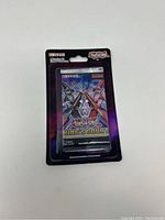 Sealed Yu-Gi-Oh! King’s Court booster pack in unopened condition with vibrant holographic packaging showing two duelists crossing swords on the front.
