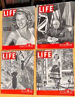 Four LIFE magazines from 1944 arranged showing their front covers, including images of a smiling woman, Winston Churchill, a military aerial photograph, and a woman in a dress.
