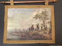 Full view of the silk painting showing the equestrian hunt scene bordered by gold embroidery and wooden hanging rod.