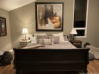 Front view of assembled bed showing headboard and footboard in room