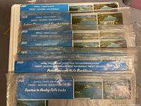 8 folded small craft charts with blue title bands showing various sections of the Trent-Severn Waterway system. Slightly worn and creased condition.