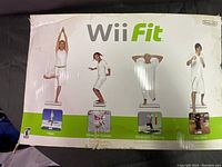 Box for Wii Fit balance board showing images of yoga, balance games, strength training, and aerobics